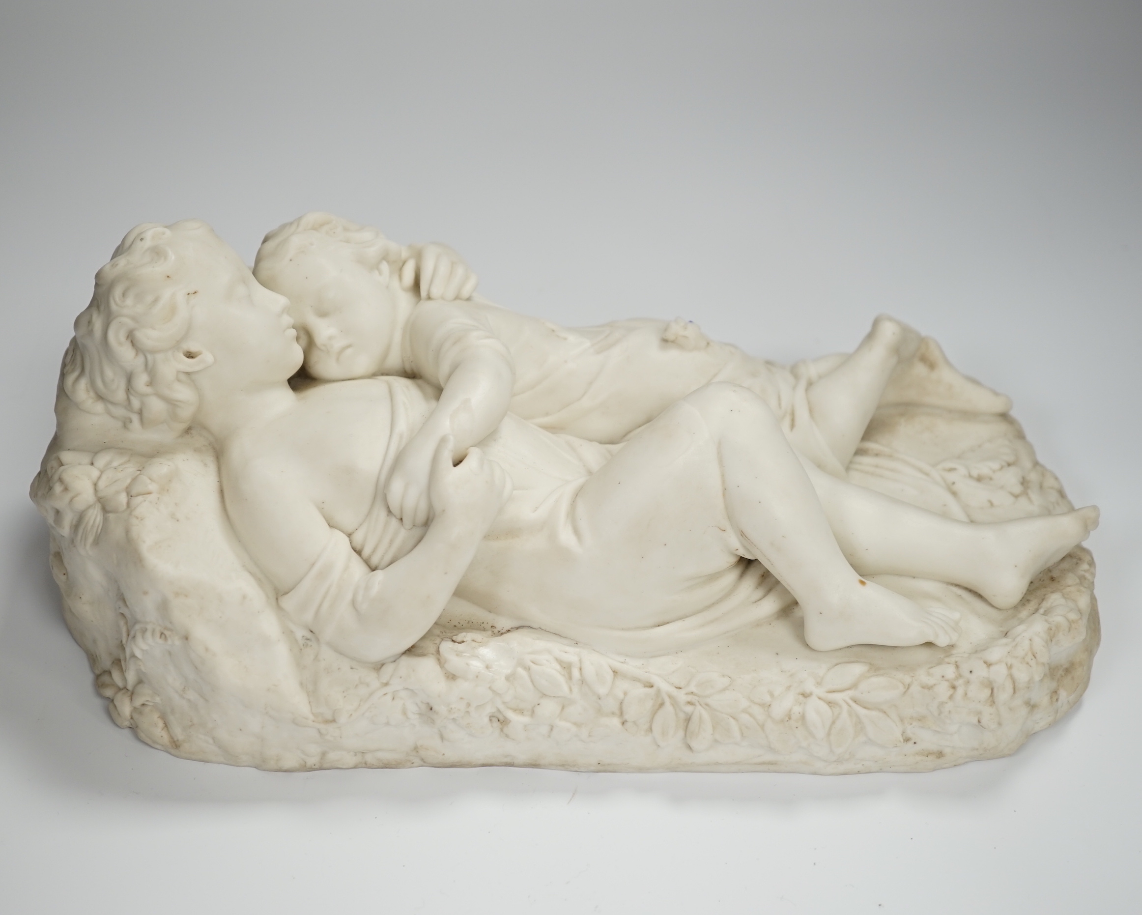 After John Bell, a Victorian parian reclining figure of a mother and child, 30cms wide